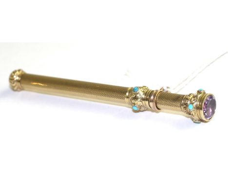 A propelling pencil, of telescopic form the top inset with a round cut amethyst in a yellow rubbed over setting, above a roun