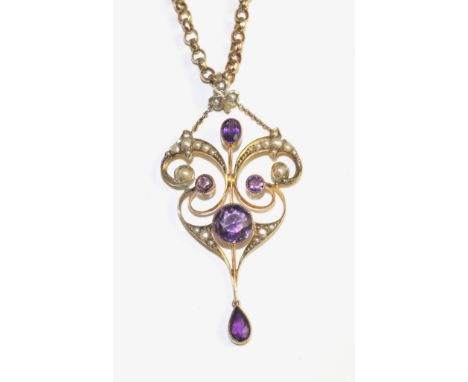 An Art Nouveau amethyst and seed pearl pendant, the openwork pendant set throughout with vari-cut amethyst in yellow milgain 