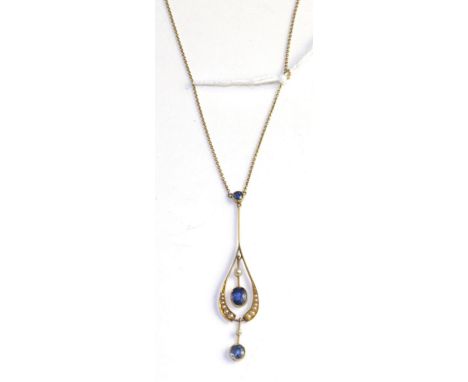 An Art Nouveau sapphire and seed pearl pendant, a round cut sapphire in a yellow milgrain setting suspends a drop shaped pend