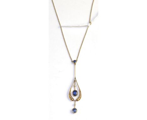 An Art Nouveau sapphire and seed pearl pendant, a round cut sapphire in a yellow milgrain setting suspends a drop shaped pend