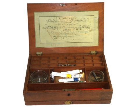 An 19th century mahogany paint box with hinge top and hidden drawer containing an arrangement of compartments and mixing bowl