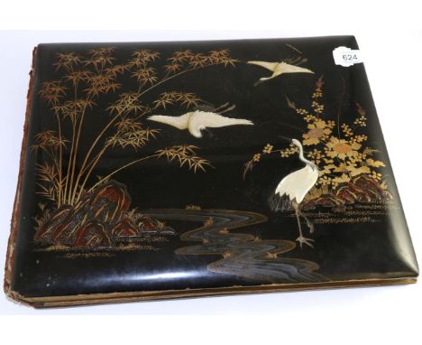 A Japanese lacquered and mother of pearl photo album, containing views of Yokohama, Kija, temples, Tokyo and a portrait of ba