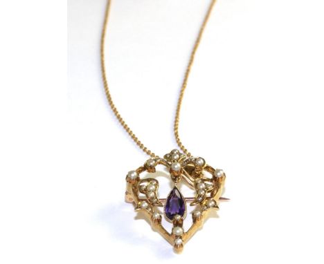 An Art Nouveau amethyst and seed pearl pendant/brooch on chain, an openwork frame set throughout with seed pearls with a cent