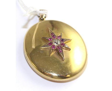 A ruby and diamond locket, an old cut diamond within a border of round cut rubies in a star setting to an oval locket on bail