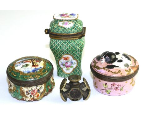 A Staffordshire enamel pill box, circa 1780, of circular form, the cover modelled and painted with a spaniel, 4cm diameter; a