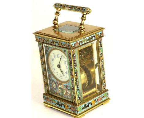 A champleve enamel carriage timepiece, circa 1910, carrying handle, multi-coloured champleve enamel borders, enamel dial with