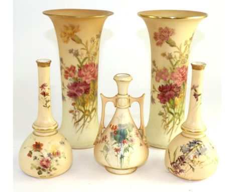 A matched pair of Royal Worcester porcelain beaker vases, 1911 and 1917, decorated with flowers on an ivory ground, 23cm high