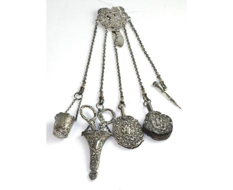 A Victorian silver chatelaine comprising thimble holder, pair of scissors, aid memoir, pencil and a pin cushion, silver hallm