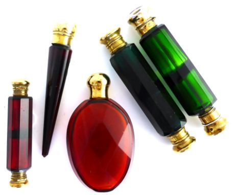 Five coloured glass scent bottles comprising two green double scent bottles and three ruby tinted examples 