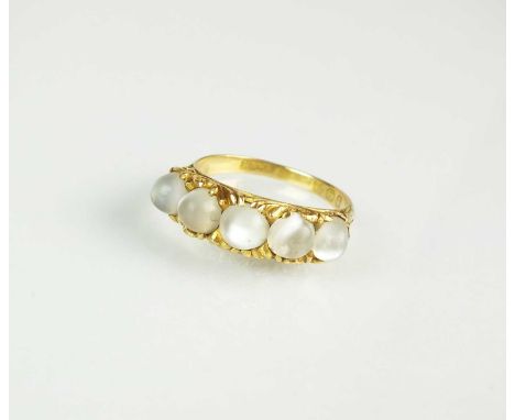 An 18ct gold Victorian five stone moonstone ring, the graduated circular cabochon moonstones claw set to scrolling mount, hal