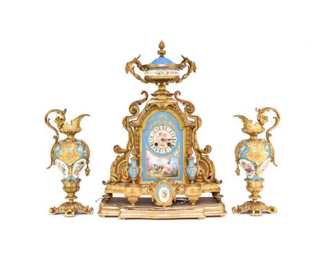 A French ormolu and porcelain clock garniture, late 19th centuryThe clock with urn finial above an arched case with leaf-capp