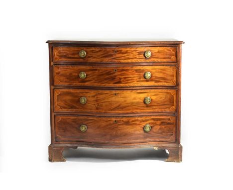 A good George III mahogany, serpentine fronted chest of drawers, or commode, crossbanded and inlaid with floral marquetry and