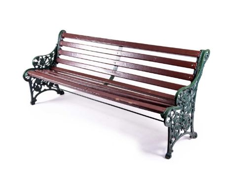 A Coalbrookdale cast iron 'Nasturtium' pattern garden bench, with wood slatted back and seat, the arms and supports cast with