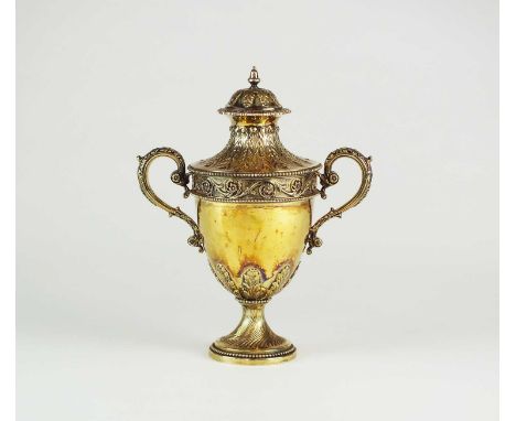 A Victorian silver gilt two-handled cup and cover of urn form, Comyns &amp; Sons, London 1896, the plain polished urn with ac