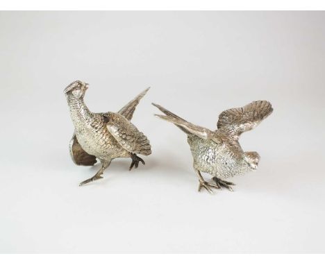 A pair of silver ornaments modelled as pheasants, Israel Freeman &amp; Son Ltd, London 1963, 8cm and 6cm high, total weight a