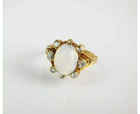 A 19th century opal and diamond ring, designed as a central oval cabochon opal mounted within eight graduated diamond set cla