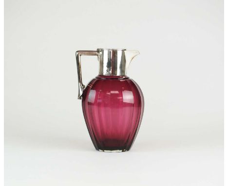 A Victorian silver mounted cranberry glass claret jug, John Grinsell &amp; Sons, Birmingham 1891, the ovoid fluted form jug w