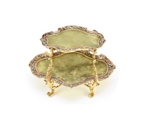 A French rococo revival two-tier onyx and champleve enamel cake standLate 19th century, the two onyx dishes of lobed ovoid fo