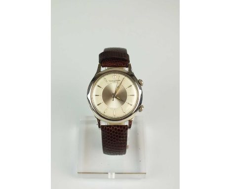 A Gentleman’s stainless steel Jaeger Le Coultre Memovox wristwatch, the white dial with batons and central silvered dial, wit