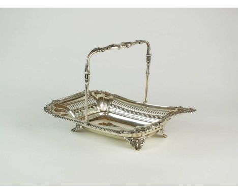 An Edwardian silver swing handled basket, Albert Sydenham, Birmingham 1904, of shaped rectangular form with gadrooned and scr