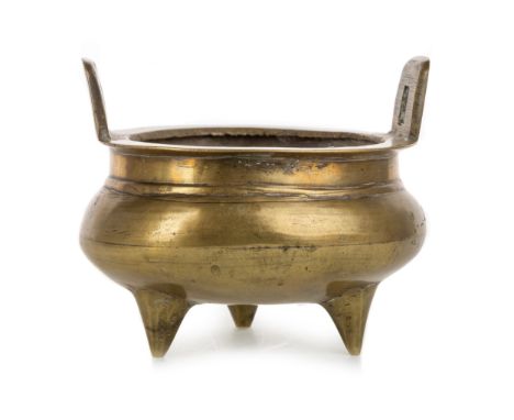 twin handled, raised on tripod feet, bearing indistinct character mark to base 12cm wide