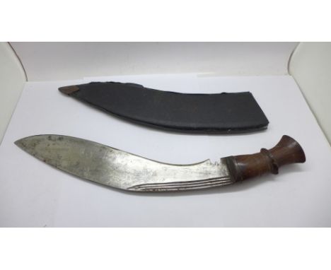 A kukri with wooden handle and scabbard 