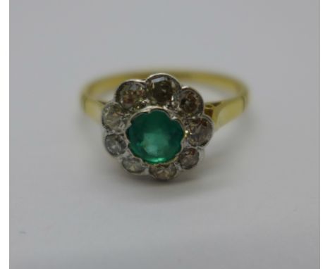 An 18ct gold, platinum set emerald and diamond ring, 2.4g, M 