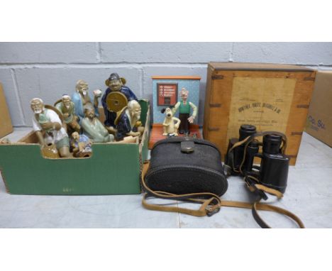Oriental figures, a pair of Russian binoculars, a Wallace and Gromit alarm clock and a small tea chest 