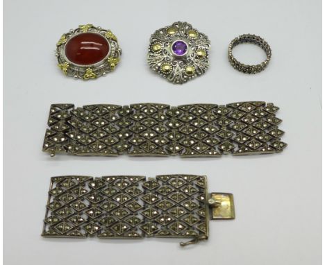 A silver and marcasite bracelet, a/f, a silver and amethyst brooch with gold applied decoration, one other silver brooch and 