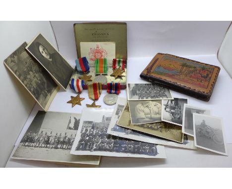 A tin of six WWII medals with an album of North Africa campaign photographs and a British Army of the Rhine certificate 30/6/