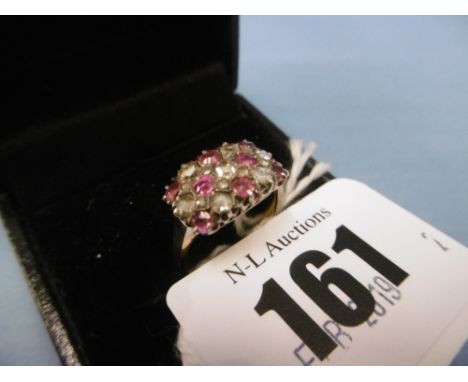 A yellow metal, ruby and diamond ring