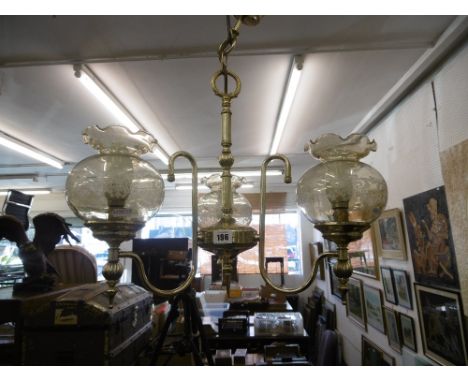 A brass three branch hanging light