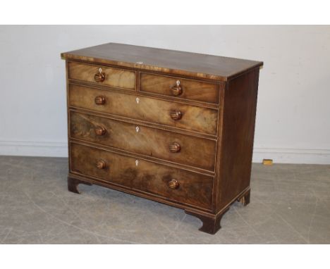 A George III  mahogany chest of drawers, the rectangular strung top above two short and three long graduating and cockbeaded 