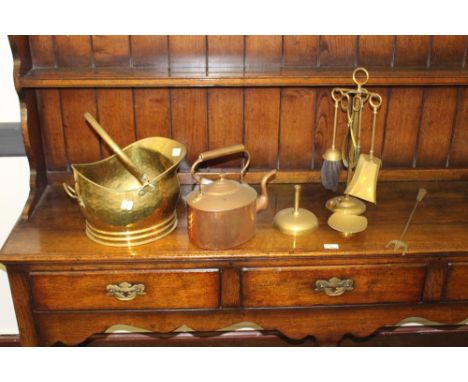 A brass coal helmet, companion set, copper kettle, toasting fork and a small brass KSIA style dish.