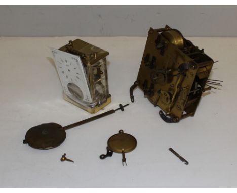 A brass chiming clock movement and a Carriage time piece, in disrepair, together with two pendulums