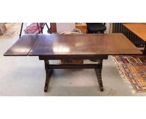 An Ercol elm draw leaf refectory table, 175cm x 71cm x 74cm high, retaining factory sticker to underside, light wear&nbsp;