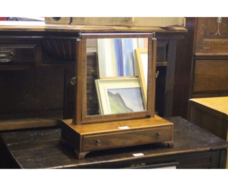 A 19th century mahogany swing toilet mirror, the rectangular plate between slender finial topped uprights, raised on a rectan