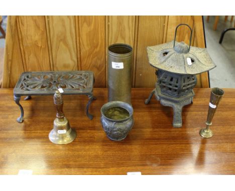 A cast-pewter Art Nouveau style vase, cast-iron exterior pagoda lantern, cast-Iron trivet, brass shell case, bell and vase