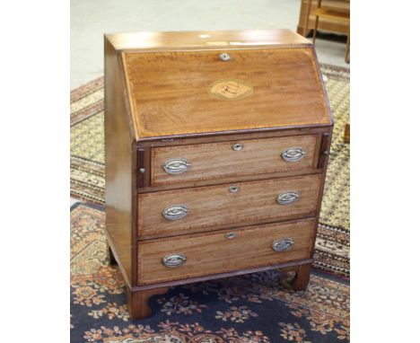 An Edwardian inlaid-mahogany bureau, the top with applied and engraved presentation inscription (see images) the banded fall-