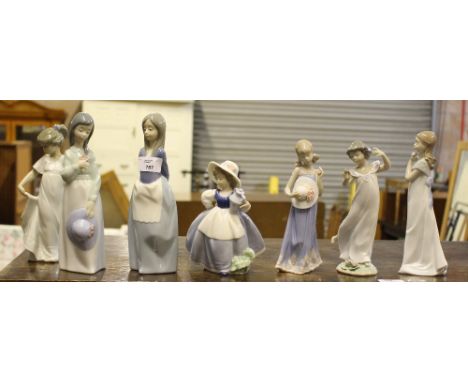 A group of three Lladro and four Nao figurines