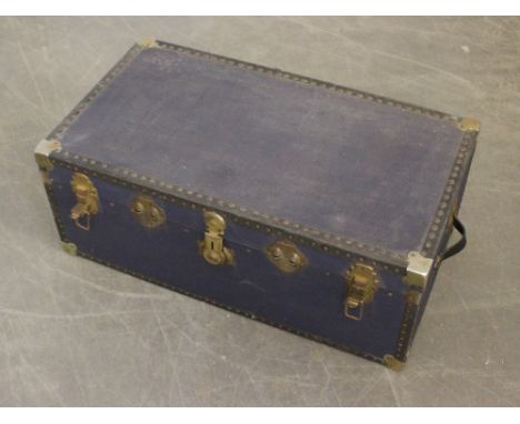 A large blue canvas travel trunk, with blue checked material lining 37cm x 92cm x 51cm used but generally good.