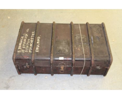 A vintage ribbed travel trunk, of traditional form. 92cm x 54cm x 33cm wormed throughout with some splits etc (AF)