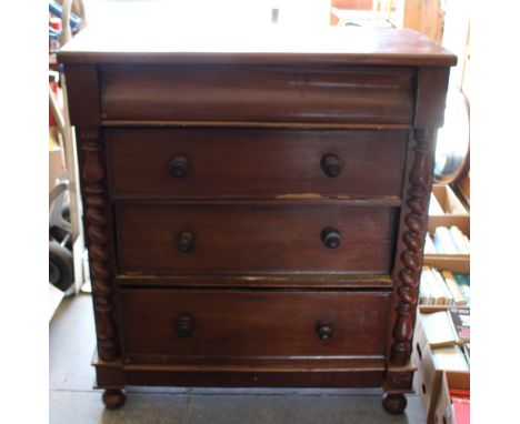 A Victorian mahogany chest of drawers, with blind frieze drawer over four long drawers and barley twist half columns, on turn