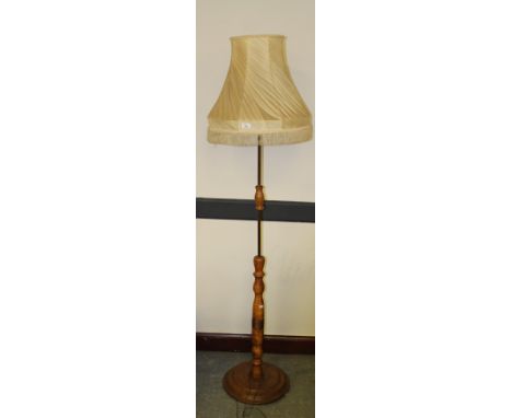 A turned elm and copper standard lamp, with shade 180cm some mould stains to shade.