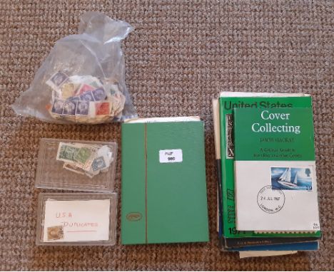 A small album of mixed franked and unfranked US stamps, a quantity of loose US stamps and five books on US stamps and first d