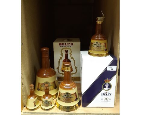 70cl Bells Elizabeth II 90th Birthday blended Scotch Whisky decanter, boxed, a 75cl Bells blended Scotch Whisky decanter and 