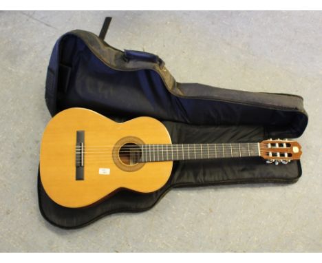 An Admira Sevilla six string acoustic guitar, in good condition, housed in a black canvas Stagg travel case