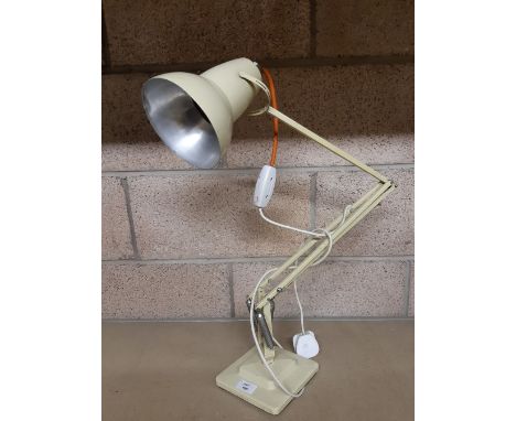 An Anglepoise cream finish electric lamp, 95cm high, slight denting to shade and wear to paint