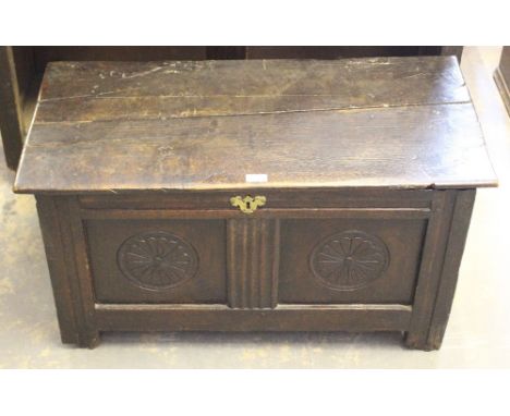 An 18th century oak two-panel coffer, the rectangular top opening on iron axe-form hinges to reveal the internal storage, the