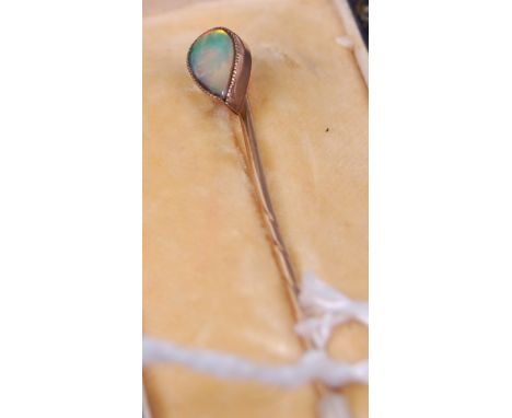 A 9ct gold opal set tie-pin, in fitted silk lined leather case